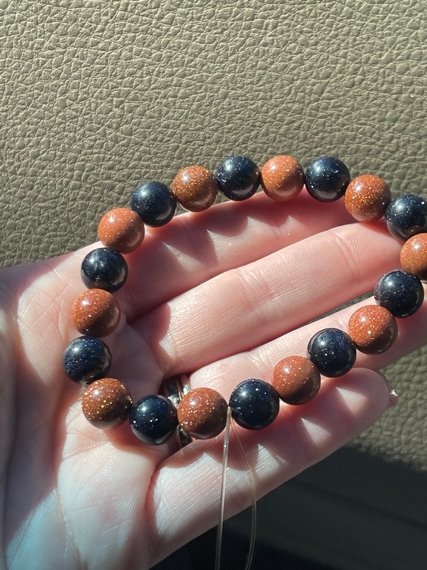 Blue & Red Goldstone/Sandstone 10mm bracelet (manmade)